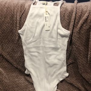 White body suit size M . Cotton on